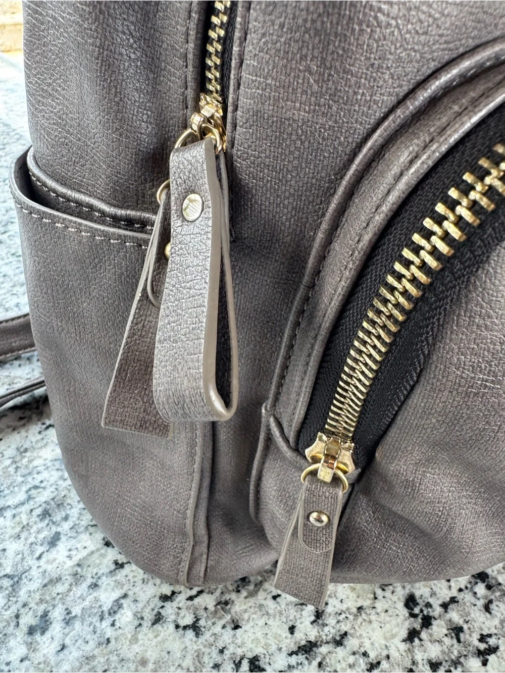 MMS Design Studio gray faux leather backpack